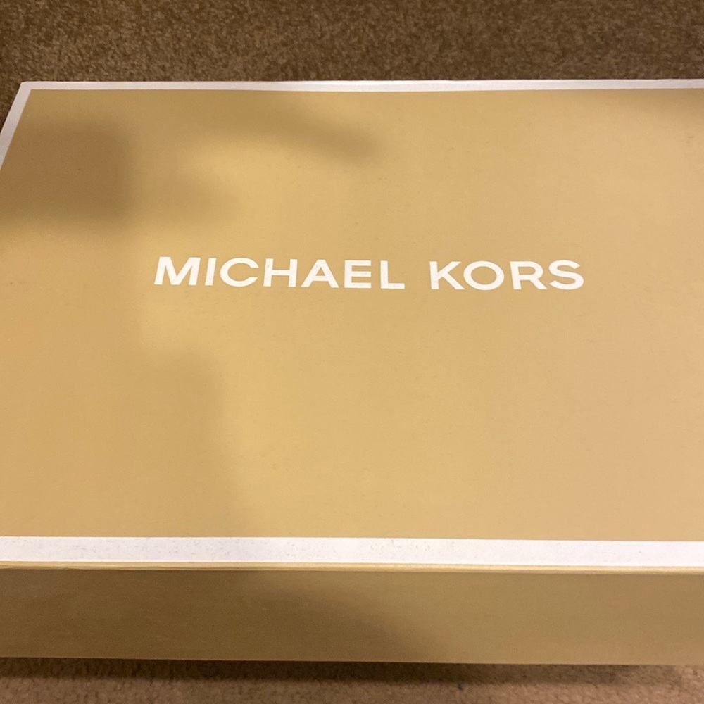 Brand new leopard pattern/faux fur Michael Kors pocketbook.